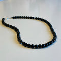 Halsband med facettslipad onyx och hematit