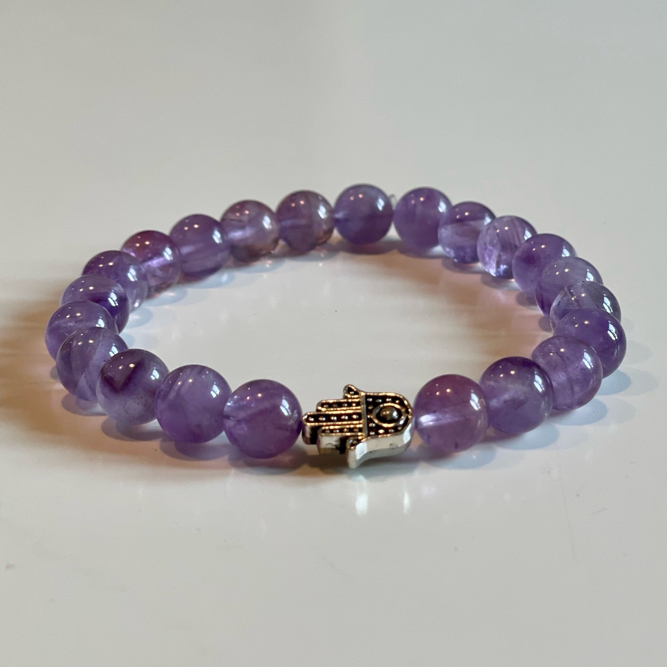 Elastiskt armband med ametist och hamsahand 8mm