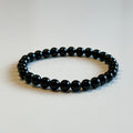 Elastiskt armband med svart turmalin 6mm